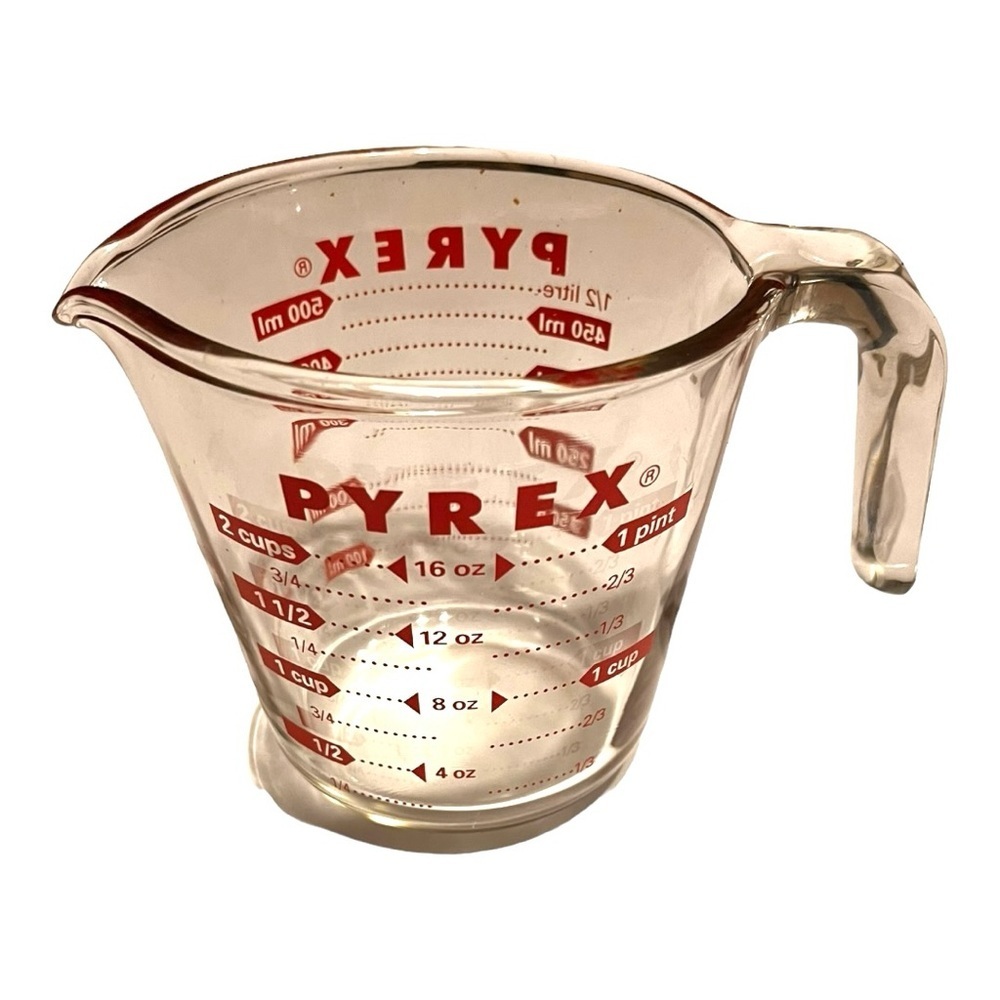 Pyrex 2 cup glass measuring cup vivid red print thumb print at top of handle.